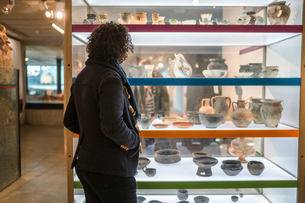 Woman looking at museum exhibit